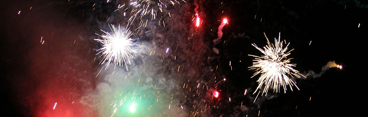 fireworks with hazy red and green smoke